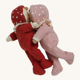 The Olli Ella Dozy Dinkum Dolls - Toadstool Pip and Moppet, posed in an embracing position. They have onesies with spotty mushroom hoods and ruffled collars.