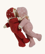 The Olli Ella Dozy Dinkum Dolls - Toadstool Pip and Moppet, posed in an embracing position. They have onesies with spotty mushroom hoods and ruffled collars.