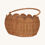Olli Ella Petal Basket in Natural Rattan, shown with the handle down.