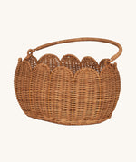 Olli Ella Petal Basket in Natural Rattan, shown with the handle down.