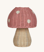 The Olli Ella rattan toadstool lamp with a natural base and a pink mushroom top