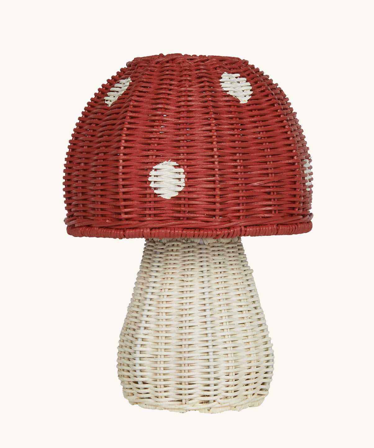 The Olli Ella rattan toadstool lamp with a white base and a red mushroom top.
