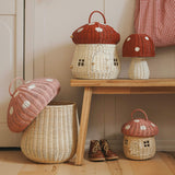 The Olli Ella large woven rattan storage baskets, in the shape of mushrooms with spotty pink and red toadstool lids.