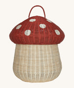 The Olli Ella large woven rattan storage basket, in the shape of a mushroom with a spotty red toadstool lid.