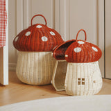 The Olli Ella large and small woven rattan storage baskets, in the shape of mushrooms with spotty red toadstool lids.