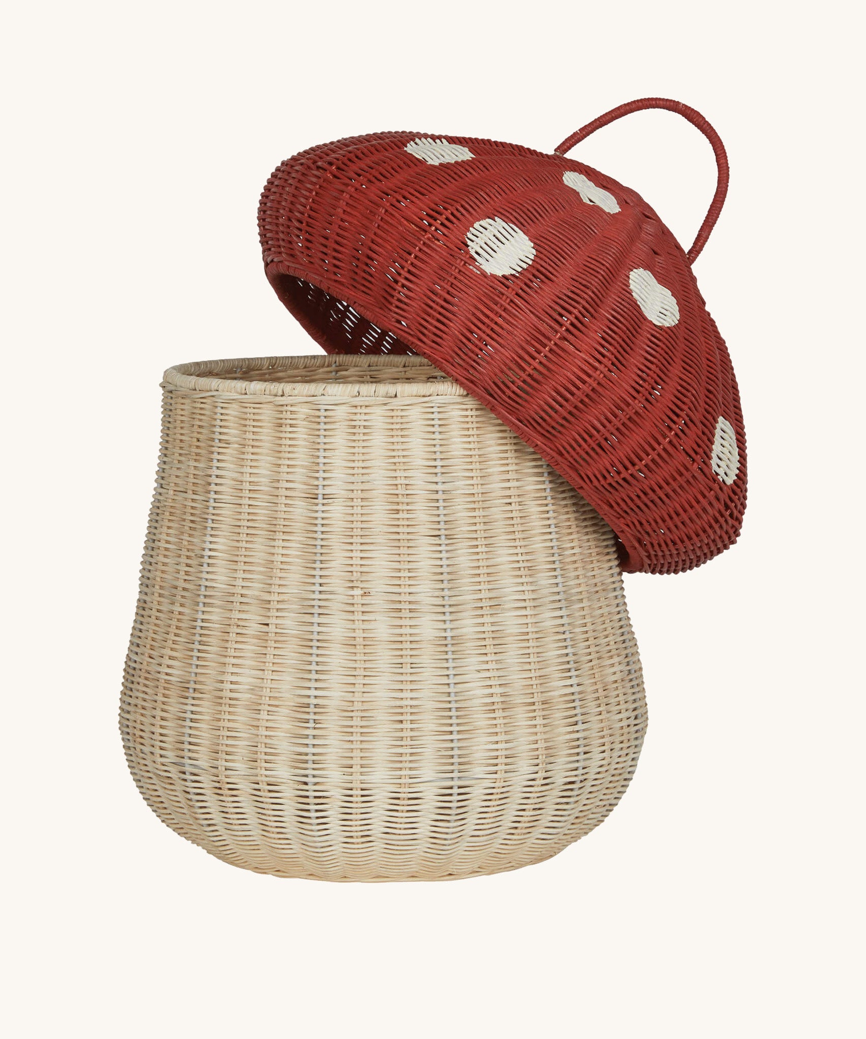 The Olli Ella large woven rattan storage basket, in the shape of a mushroom with a spotty red toadstool lid.