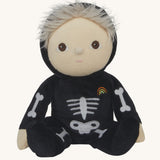 Olli Ella Scully Skeleton Dinky Dinkum Doll soft toy. The doll features glow in the dark bone details on the front along with a small embroidered rainbow on the chest. These soft toys are part of Olli Ella's Halloween collection available here at Babipur.