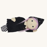 An Olli Ella Willa Witch Dinky Dinkum Doll laying on it's side. A witch with a black outfit and matching hat with glow in the dark features on the striped tights, collar ans tars on the hat. These soft toys are part of Olli Ella's Halloween collection available here at Babipur.