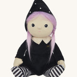 Olli Ella Willa Witch Dinky Dinkum Doll. A witch with a black outfit and matching hat with glow in the dark features on the striped tights, collar and stars on the hat. These soft toys are part of Olli Ella's Halloween collection available here at Babipur.