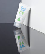 A tube of Organic Babies Baby Wash & Shampoo Scent Free placed on a mirrored surface.