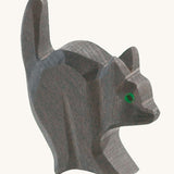 A black wooden Ostheimer cat for the witch figure on a cream background.