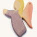 A wooden violet angel figure on a cream background