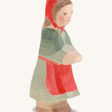 A wooden Ostheimer little red riding hood figure on a cream background