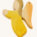 A yellow wooden angel figure on a cream background