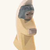 A yellow Ostheimer little angel wooden toy figure.
