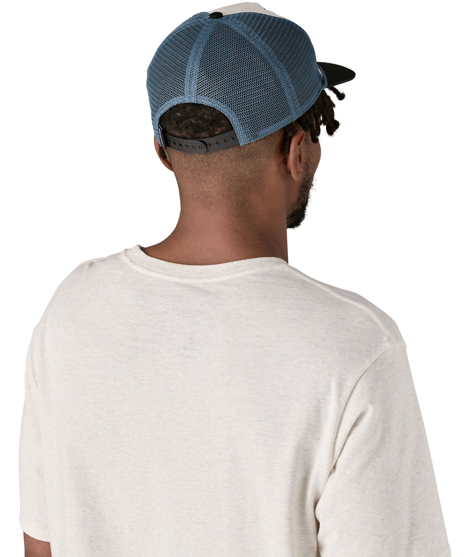 Patagonia airfarer cap in a birch white colour and Chouinard crest design worn by an adult back detail