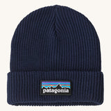 Patagonia kids beanie in new navy. A ribbed style beanie and features a turn up cuff with a brand patch stitched on top
