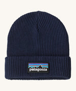 Patagonia kids beanie in new navy. A ribbed style beanie and features a turn up cuff with a brand patch stitched on top