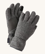Close up of the Patagonia kids synchilla gloves clipped together for easy carrying features a grip panel on the palm, thumb and index finger.  Logo patch stitched on the wrist cuff.