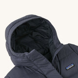 A close up of the hood on the Patagonia Kids Silent Down Parka in a Smolder Blue colour on a plain background.