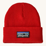 Patagonia kids beanie. A ribbed style hat in vibrant red with the logo patch stitched on the turned up brim.