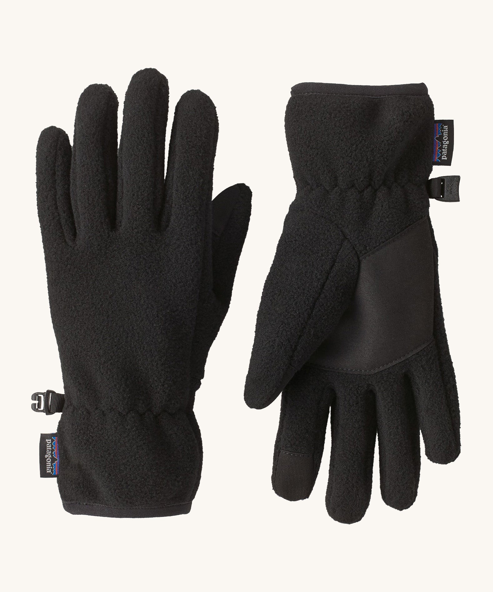 Patagonia kids synchilla gloves. A pair of solid black light fleece fabric gloves, features a grip panel on the palm, thumb and index finger.   Logo patch stitched on the wrist cuff.