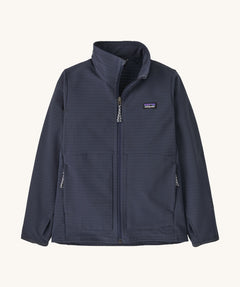 Patagonia kids tech face jacket in a navy  colour on a cream background.