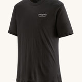 The Patagonia Men's Capilene Cool Merino Graphic Shirt with a Heritage Header design in Black on a plain background.