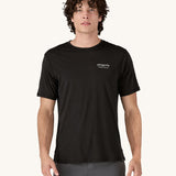 A man wearing the Patagonia Men's Capilene Cool Merino Graphic Shirt with a Heritage Header design in Black.