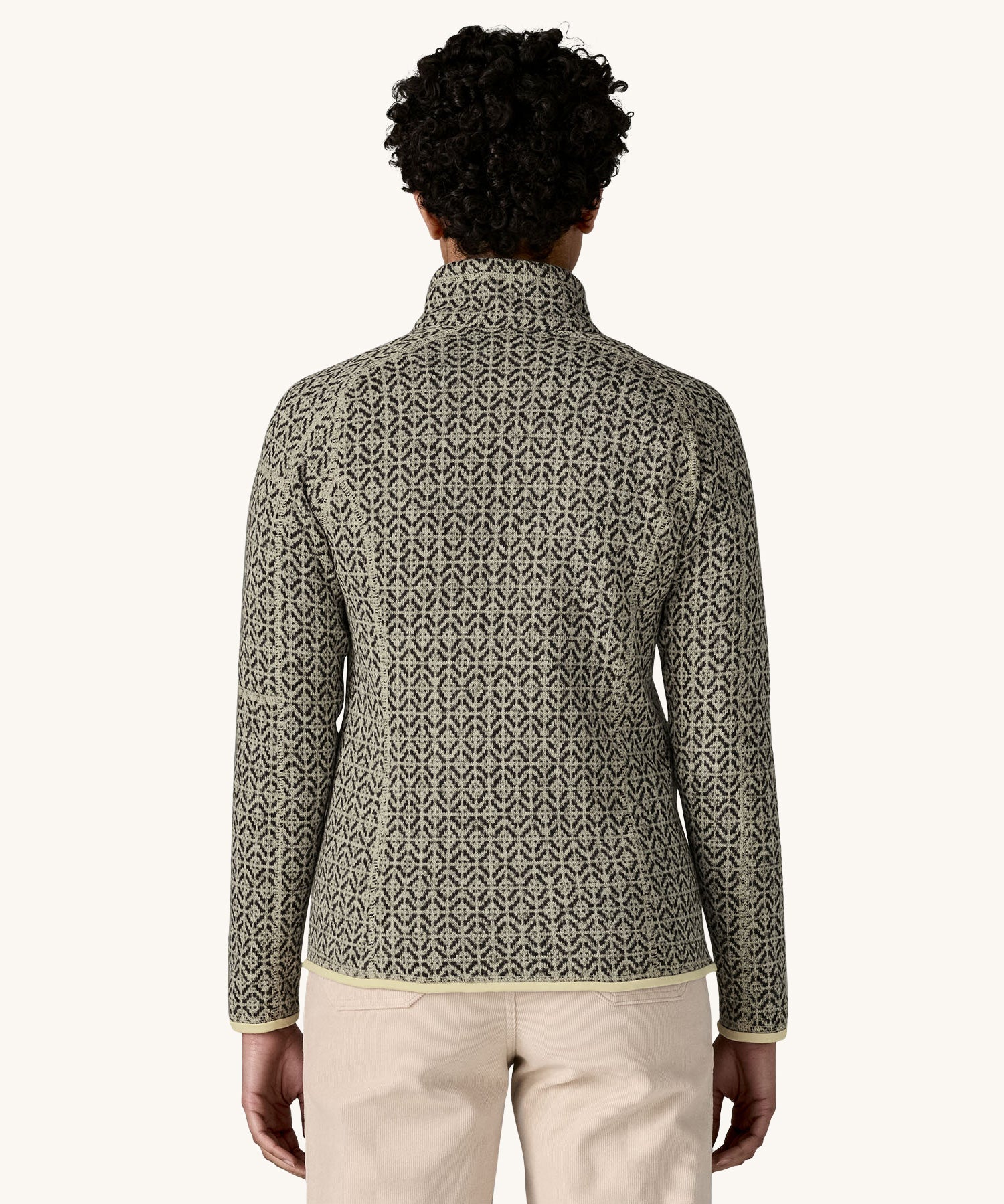 A woman wearing the Patagonia Women's Better Sweater Jacket with a scales pattern We have a wide selection of Patagonia adults and children's clothing here at Babipur.