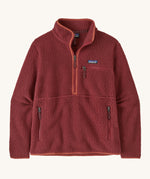 Patagonia women's marsupial retro pile fleece in sequoia red. A thick fleece in a rich red colour with light red trim. Features  2 side and chest pockets with a brand patch stitched on the chest and a half length zip.