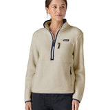 A woman wearing the Patagonia natural marsupial retro fleece showing front trim and zip detail available at Babipur.