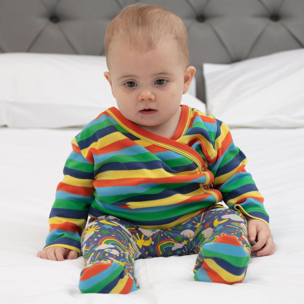 and a top knotted hat and footed baby trousers