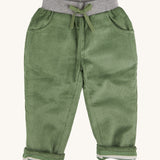 Pigeon Organics linen cord trousers - GOTS green coloured organic cotton trousers in a corduroy style. Features a soft elastic waistband in grey and green drawstring detail at the front.