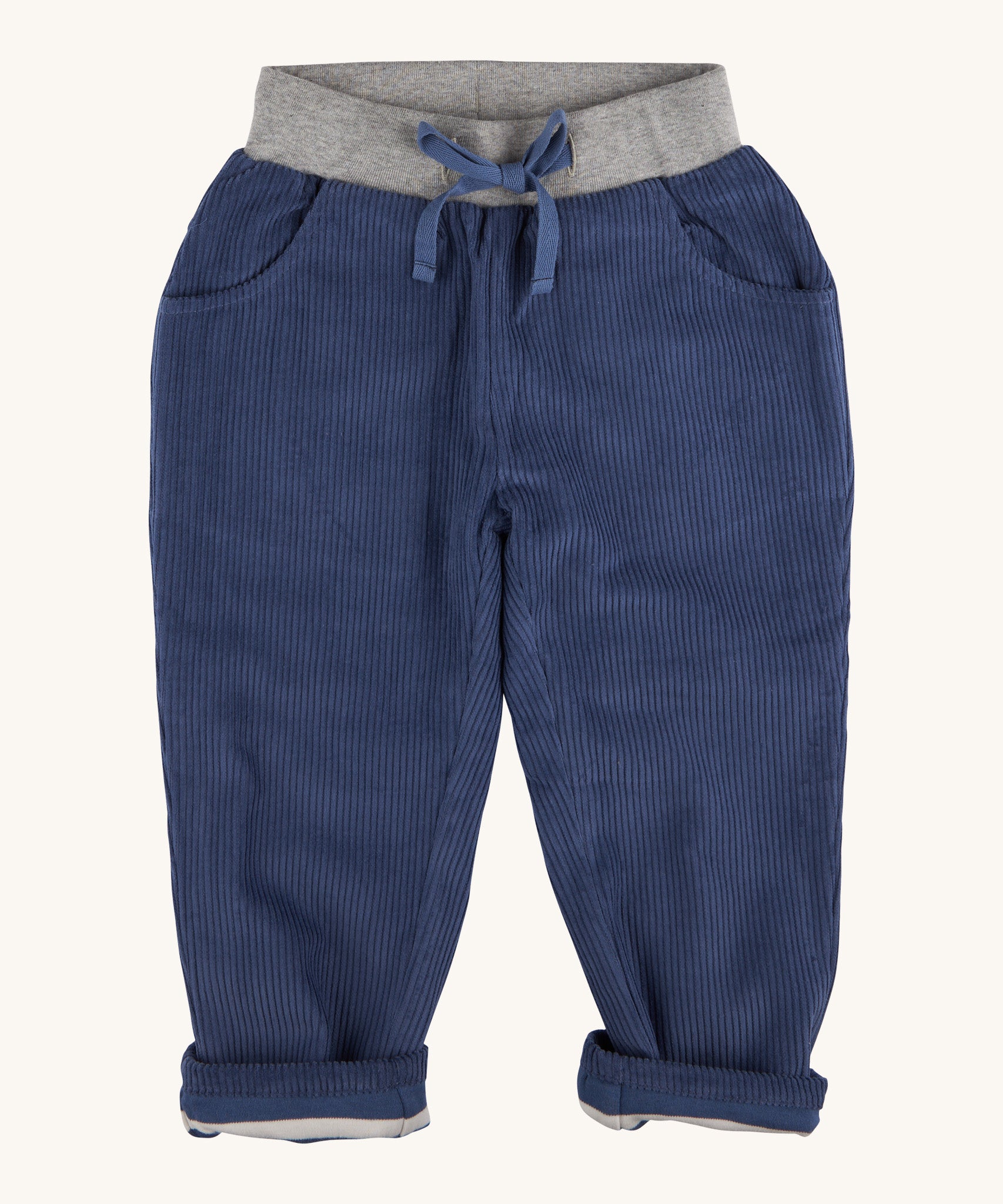 Pigeon Organics linen cord trousers - GOTS midnight blue coloured organic cotton trousers in a corduroy style. Features 2 side pockets, a soft elastic waistband in grey and green drawstring detail at the front.