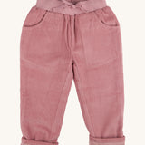 Pigeon Organics linen cord trousers - GOTS pink coloured organic cotton trousers in a corduroy style. Features 2 side pockets, a matching pink elastic waistband and drawstring detail at the front.