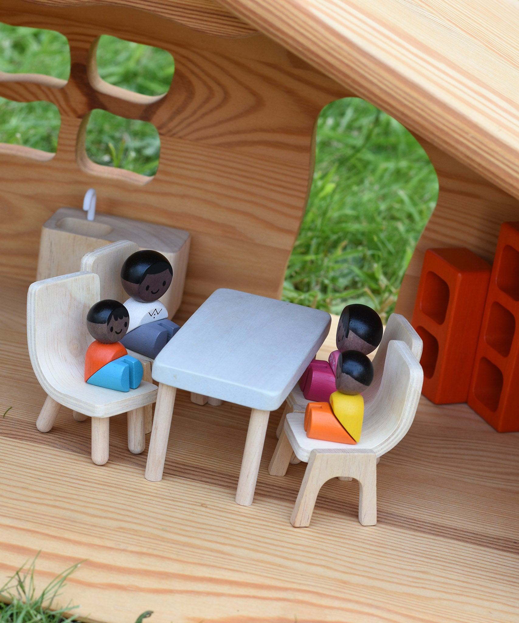 The Plan Toys black skin, black hair wooden doll family placed in an Ostheimer dolls house with wooden PlanToys dolls house furniture.
These wooden toys are part of a large range of wooden toys here at Babipur.