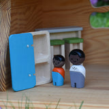 The Plan Toys black skin, black hair wooden doll family placed in an Ostheimer dolls house with wooden PlanToys dolls house furniture.
These wooden toys are part of a large range of wooden toys here at Babipur.