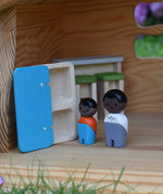 The Plan Toys black skin, black hair wooden doll family placed in an Ostheimer dolls house with wooden PlanToys dolls house furniture.
These wooden toys are part of a large range of wooden toys here at Babipur.