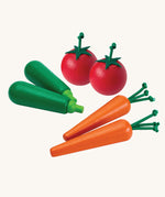 Plan Toys Produce Vegetable Set containing wooden Carrots, Courgettes & Tomatoes play food.