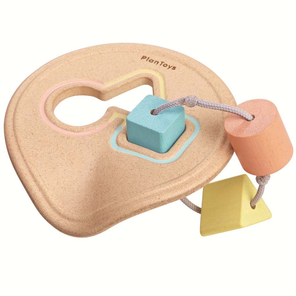 The PlanToys Shape Sorter in pastel shades on a plain background.