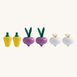 Plan Toys wooden play food Produce Set containing Radish, Garlic & Yellow Peppers. The produce have been lined up.