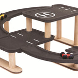 A side view of the PlanToys PlanWorld Race N Play Parking Garage on a plain background.