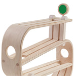A close up of teh wooden track of the PlanToys Ramp Racer on a plain background.