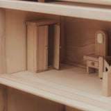 A close up of the furniture inside one of the rooms in the PlanToys Victorian Dolls House.