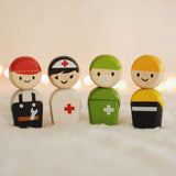 The PlanToys PlanWorld Rescue Crew on a fluffy surface, fairy lights can be seen in the background.