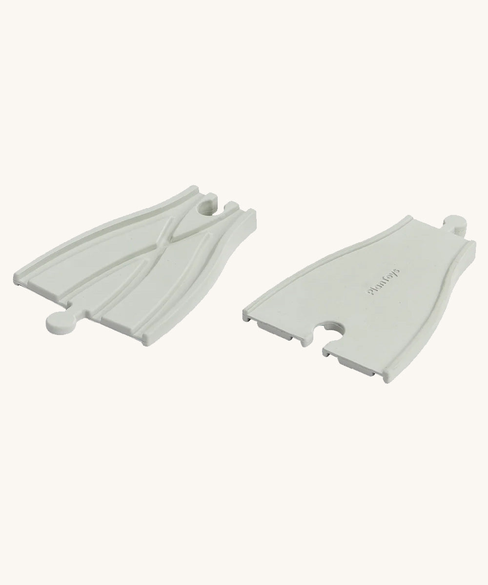 PlanToys Rubber Road and Rail Adaptor Tracks on a plain background.