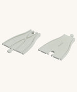 PlanToys Rubber Road and Rail Adaptor Tracks on a plain background.