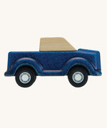 A side on view of the PlanToys Blue Truck on a plain background.