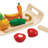 The PlanToys Assorted Fruit & Vegetables Tray play food set including orange